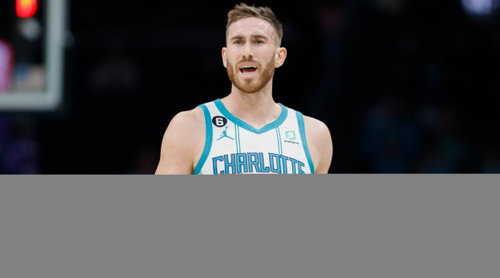 Hornets guard Gordon Hayward raises his arms to question a call